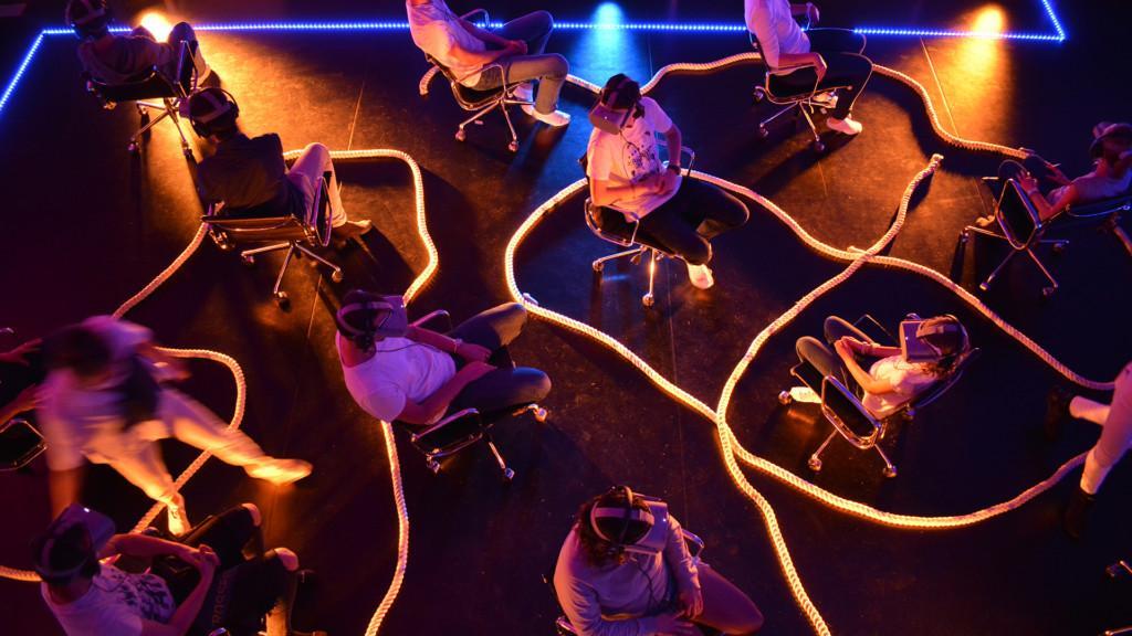 Image from Hold On by Fheel Concepts. People are sitting on chairs wearing VR headsets.